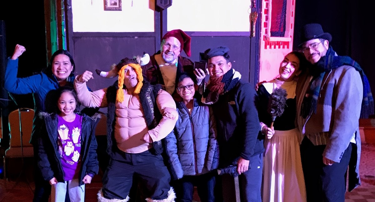 Improv actors performing a holiday-themed murder mystery in Lambertville, NJ