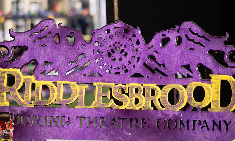 A dynamic festival scene in NJ with performers engaging the audience